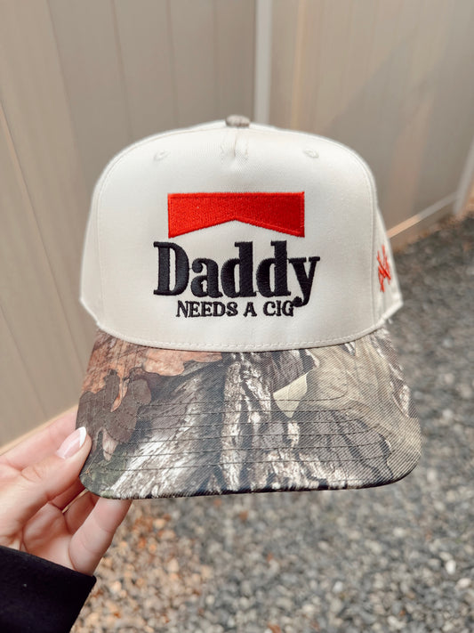 Daddy Needs a Cig Trucker Hat - Retro Mossy Oak/Natural